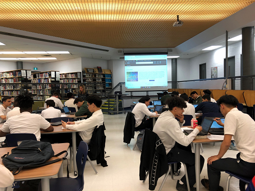 Picture of students sitting at tables